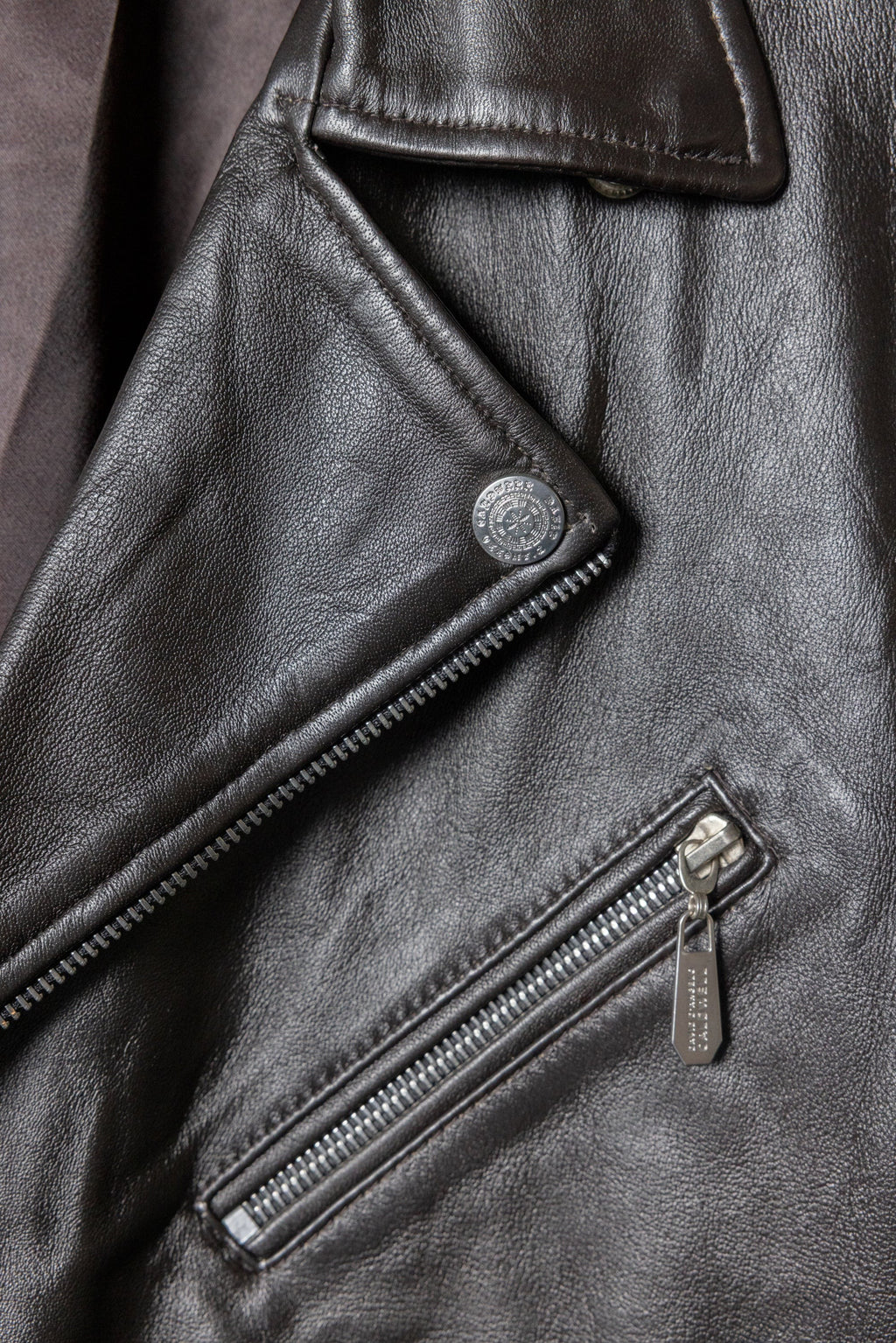 David Dangelo Caldwell dark brown nappa lamb leather biker jacket with Aztec snaps and custom zipper pulls.