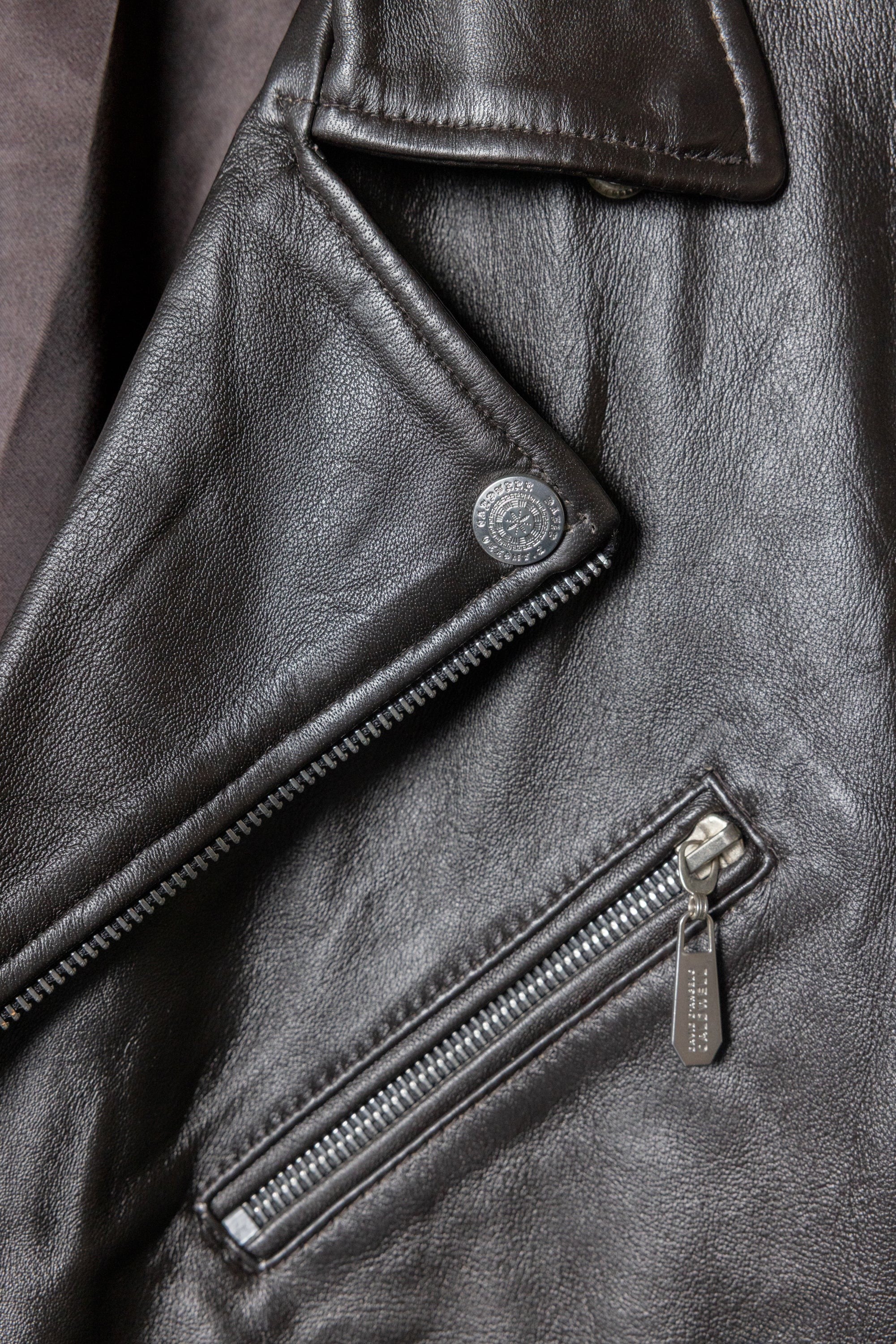 David Dangelo Caldwell dark brown nappa lamb leather biker jacket with Aztec snaps and custom zipper pulls.