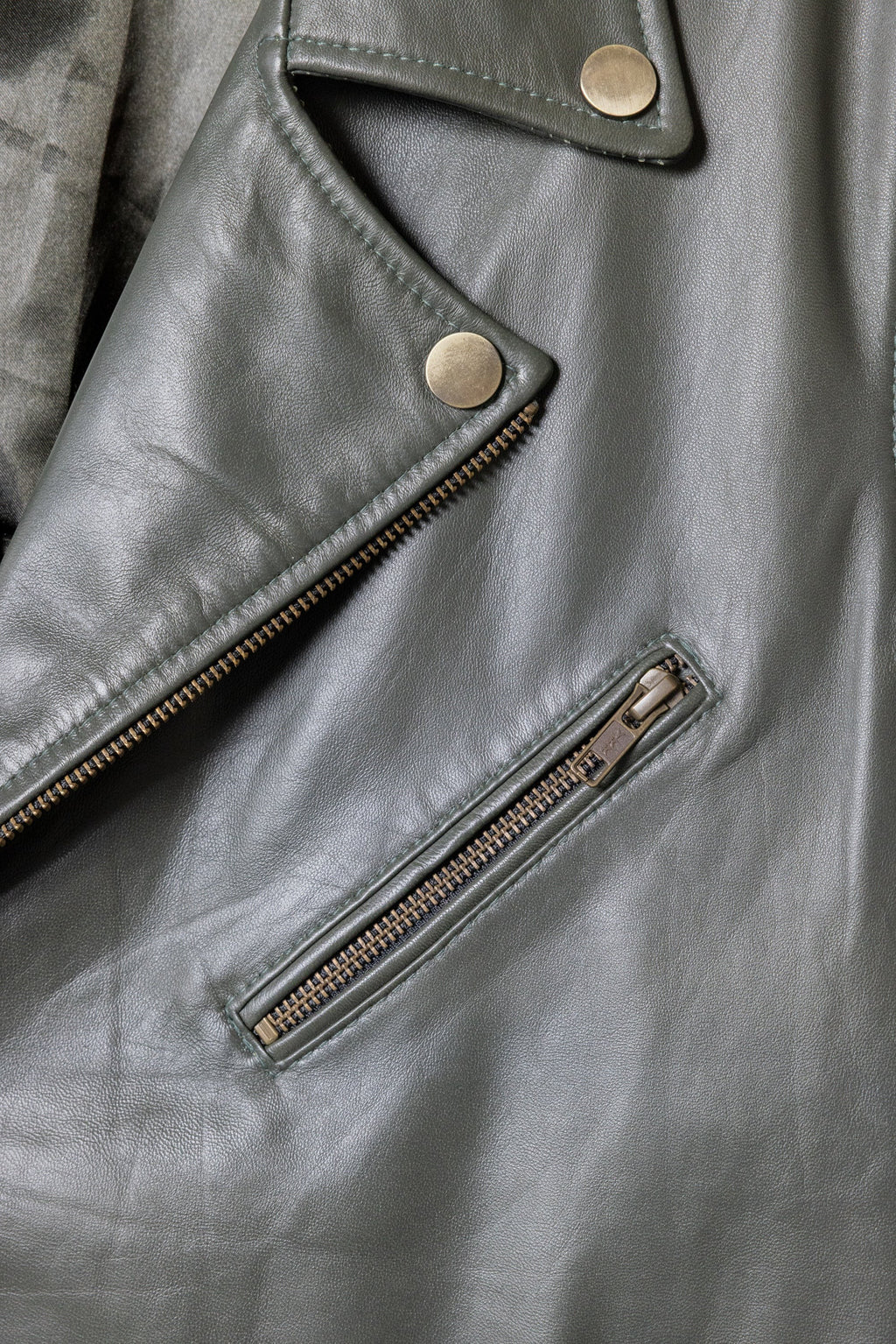 David Dangelo Caldwell olive green nappa lamb leather biker jacket with Aztec snaps and custom zipper pulls.