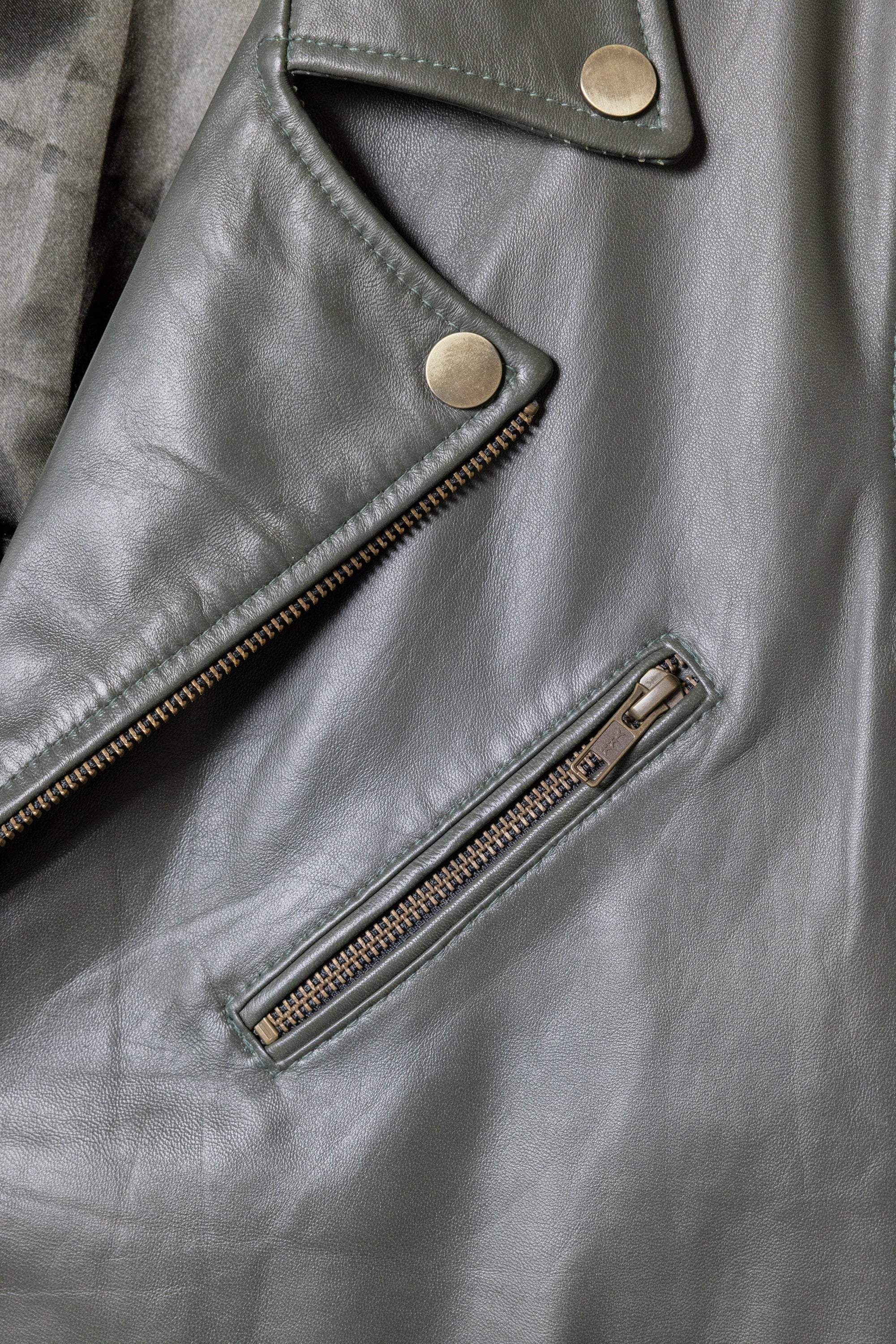 David Dangelo Caldwell olive green nappa lamb leather biker jacket with Aztec snaps and custom zipper pulls.