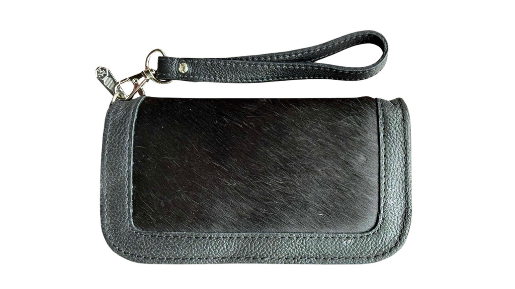 David Dangelo Caldwell black leather and hair-on-hide wristlet clutch with silver hardware and wrist strap.
