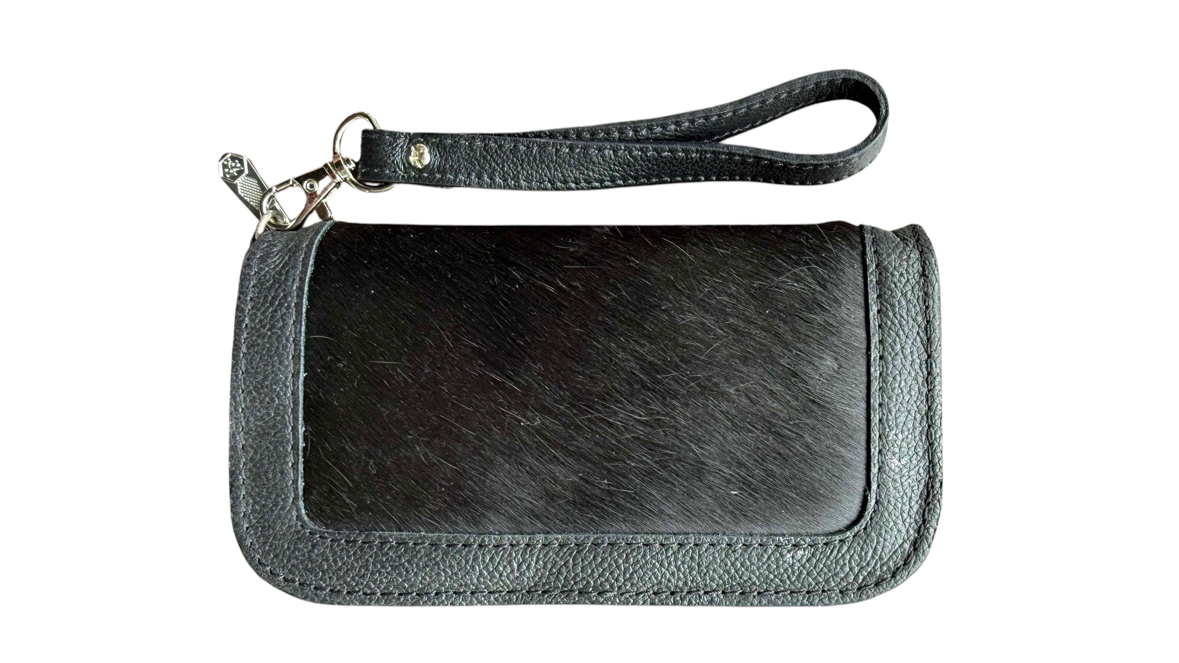 David Dangelo Caldwell black leather and hair-on-hide wristlet clutch with silver hardware and wrist strap.