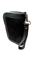 David Dangelo Caldwell black leather and hair-on hide wristlet clutch with silver hardware and wrist strap.