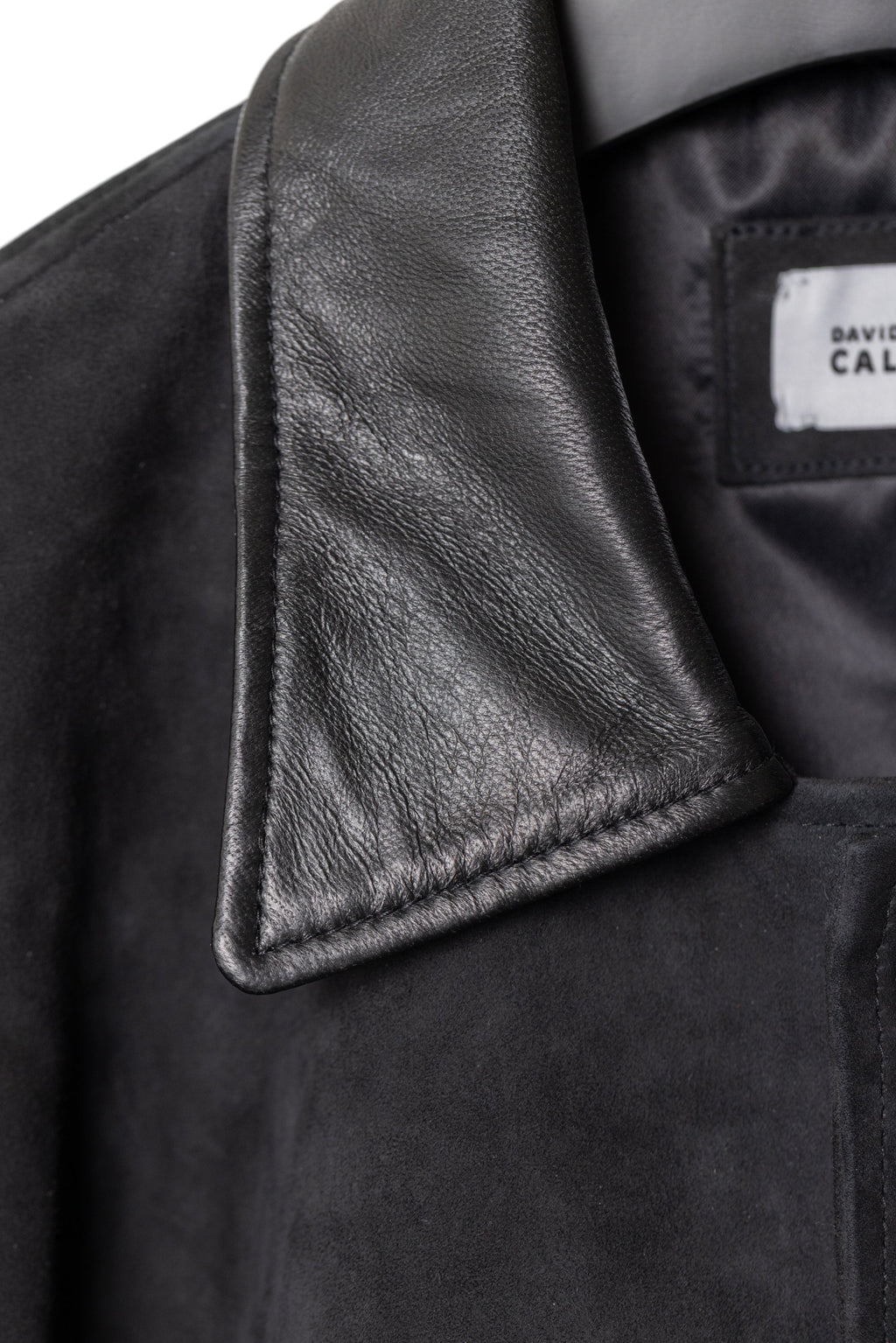 David Dangelo Caldwell black suede varsity jacket with black leather collar, sleeves, and welt pockets. Silk lining.