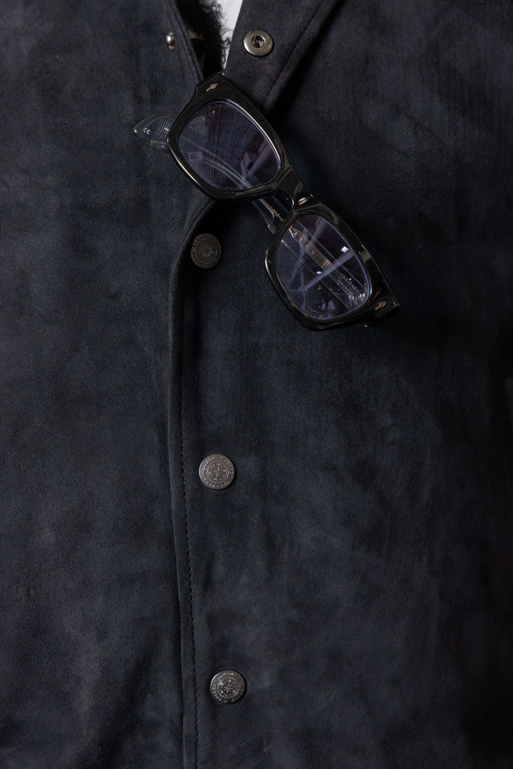 David Dangelo Caldwell black suede varsity jacket with nappa lamb skin sleeves, collar, and welt pockets. Silk lining.
