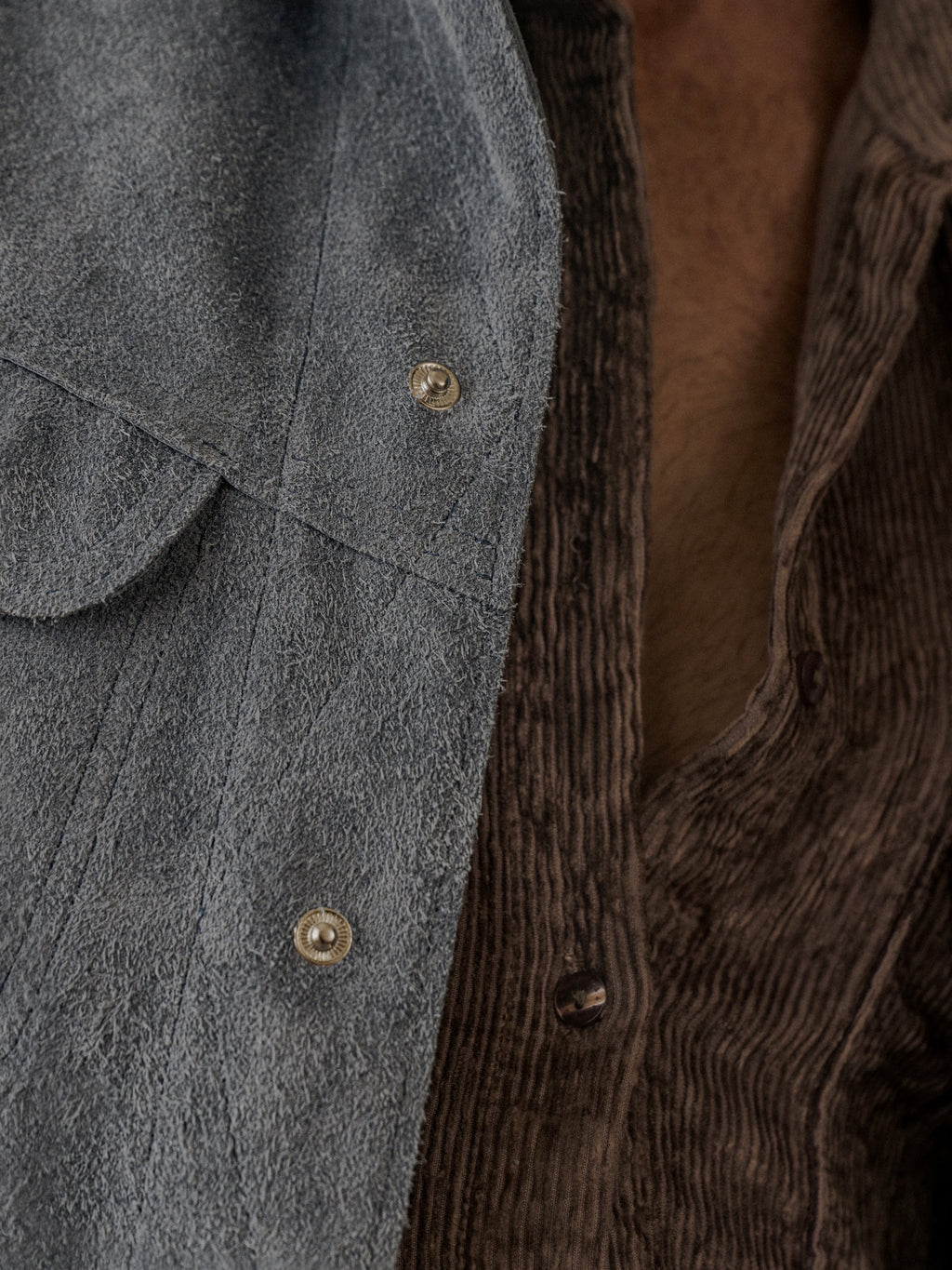David Dangelo Caldwell blue suede trucker jacket with exposed seams and proprietary hardware, reversible design.