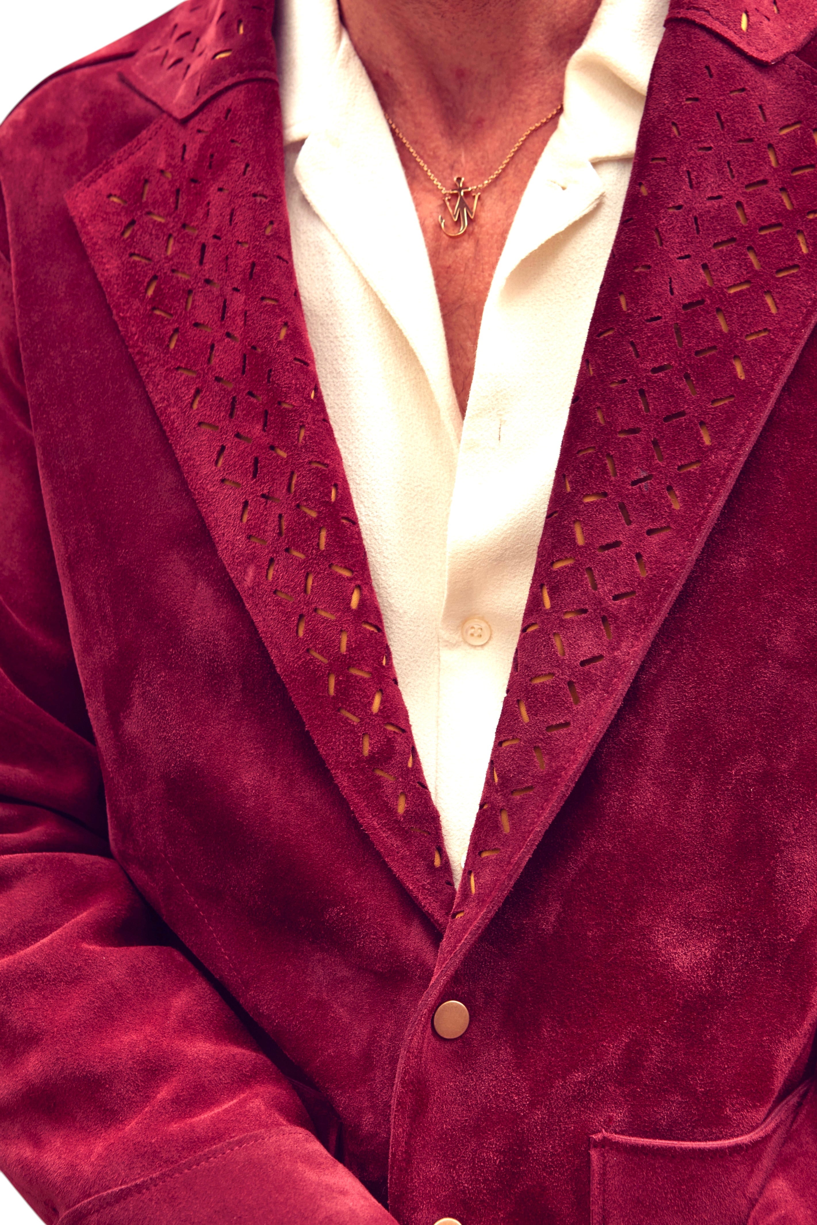 David Dangelo Caldwell The Galaton deep red suede jacket with laser-cut lapel detail and gold buttons.