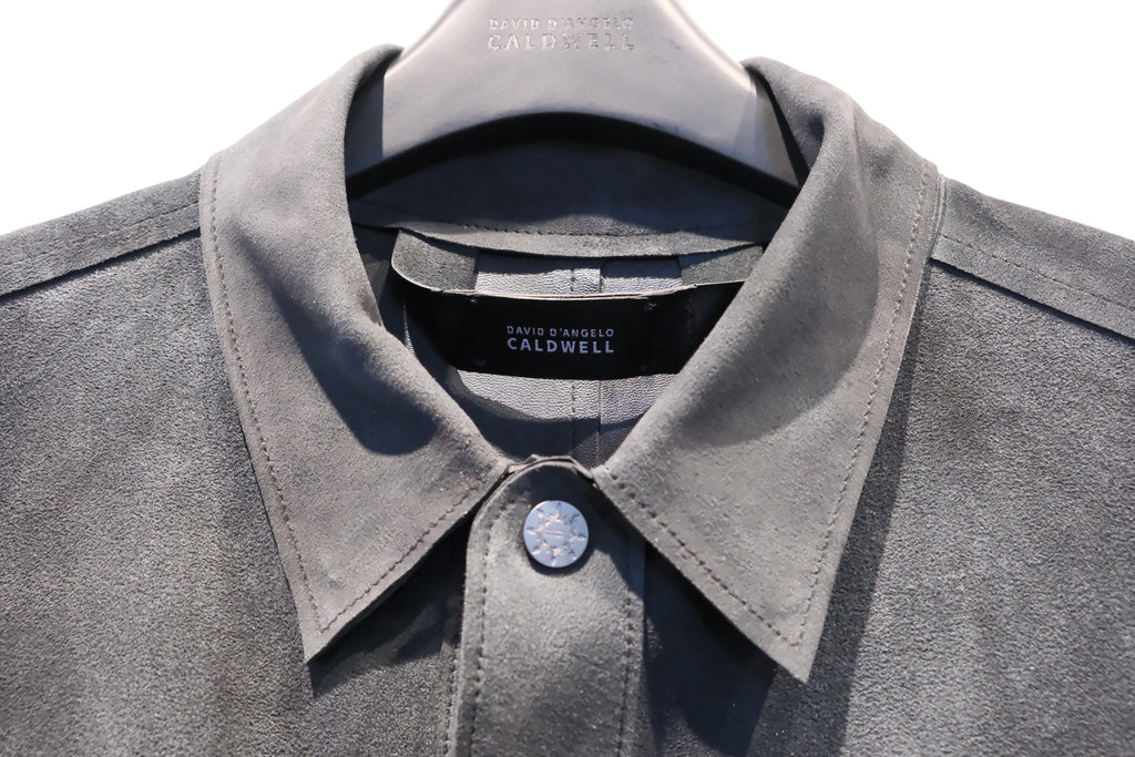 David Dangelo Caldwell grey suede jacket with exposed seams and custom hardware button.