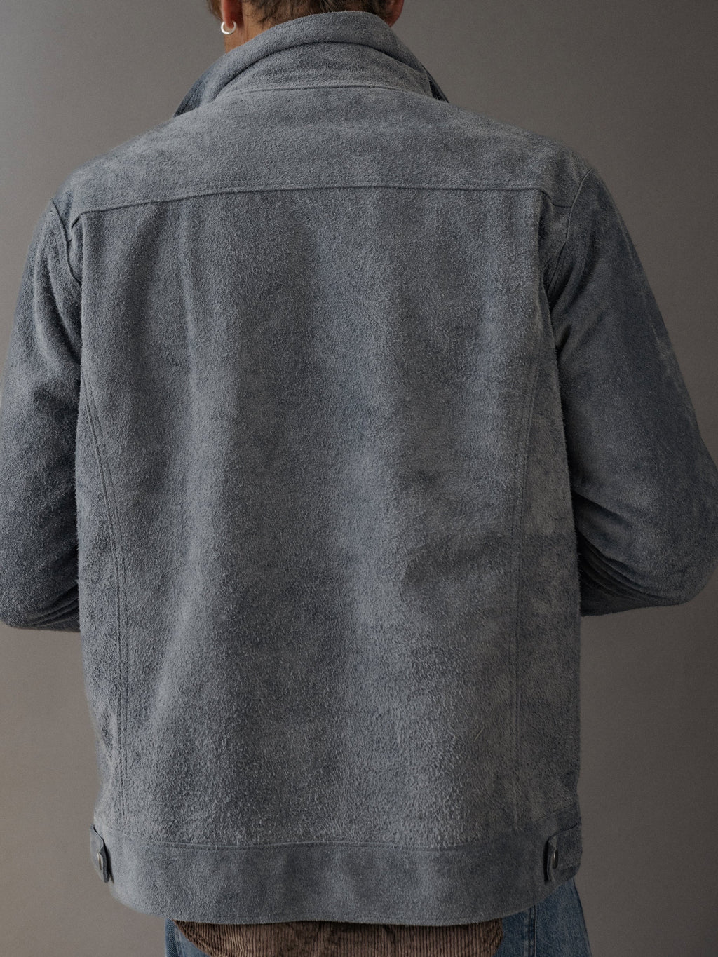David Dangelo Caldwell grey suede trucker jacket with exposed seams, classic fit, and reversible design.