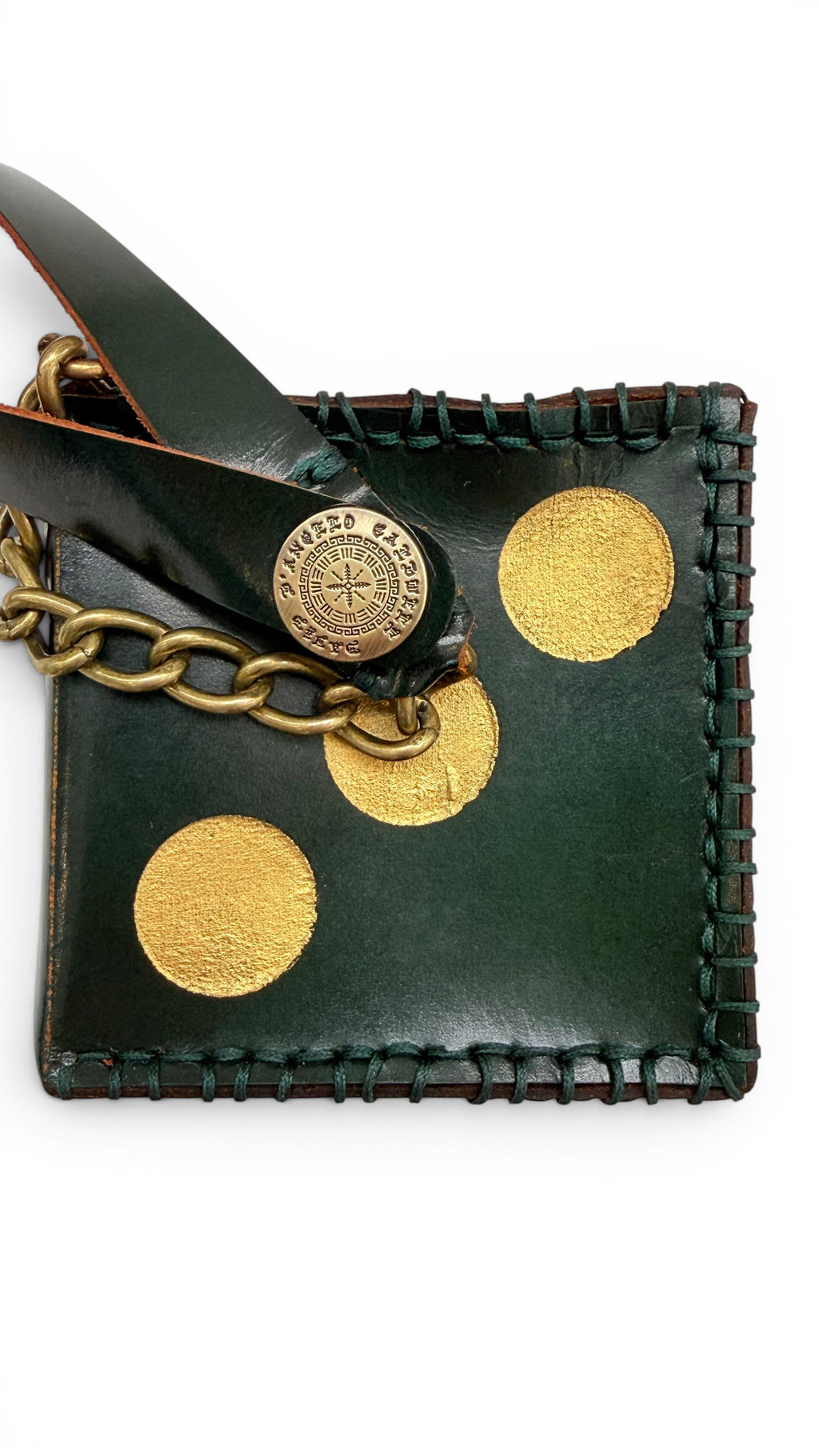 David Dangelo Caldwell dark green leather die charm with gold dots and brass chain, stitched edges.