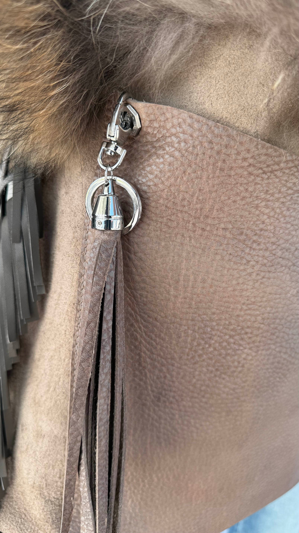 David Dangelo Caldwell natural Finnish raccoon fur and leather fringe tote bag with tassel detail.