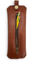 David Dangelo Caldwell brown bison leather pencil pouch with zipper closure and two yellow pencils.