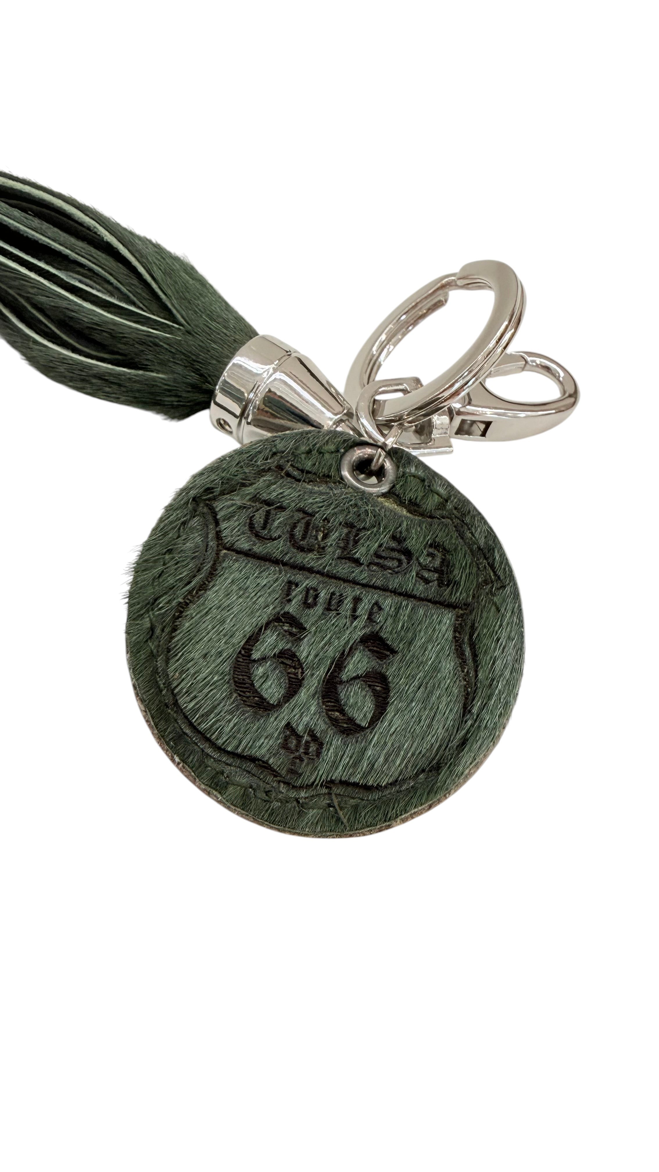 David Dangelo Caldwell dark green leather tassel keychain with a circular Route 66 emblem.