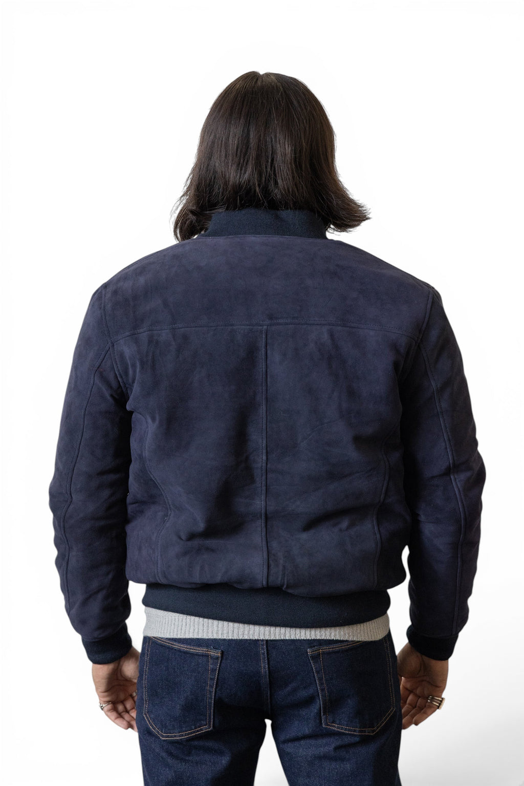 David Dangelo Caldwell navy blue suede bomber jacket with puffer lining and ribbed cuffs. Classic fit.