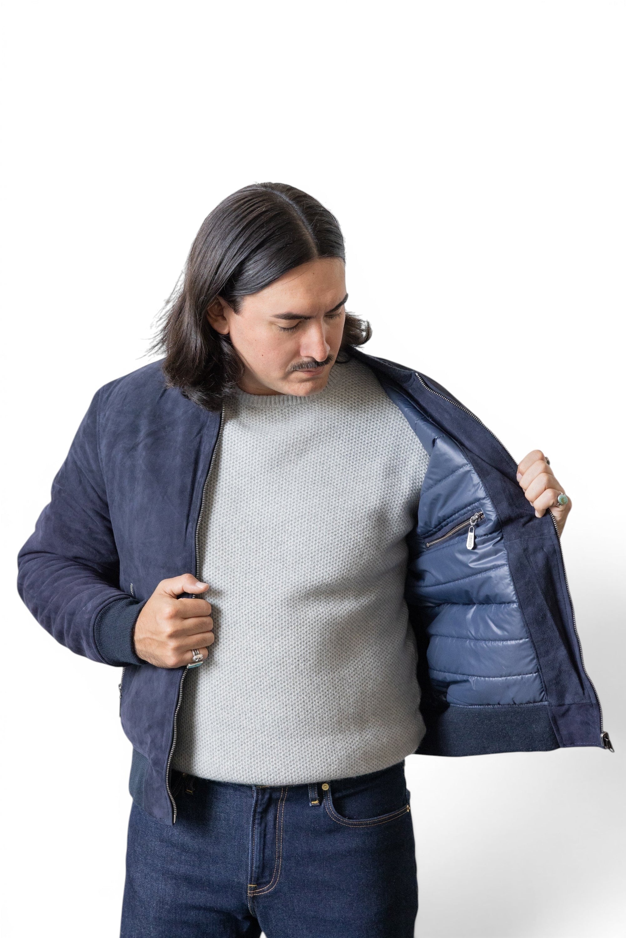 David Dangelo Caldwell navy blue reversible bomber jacket in nappa lamb suede with puffer lining and custom hardware.