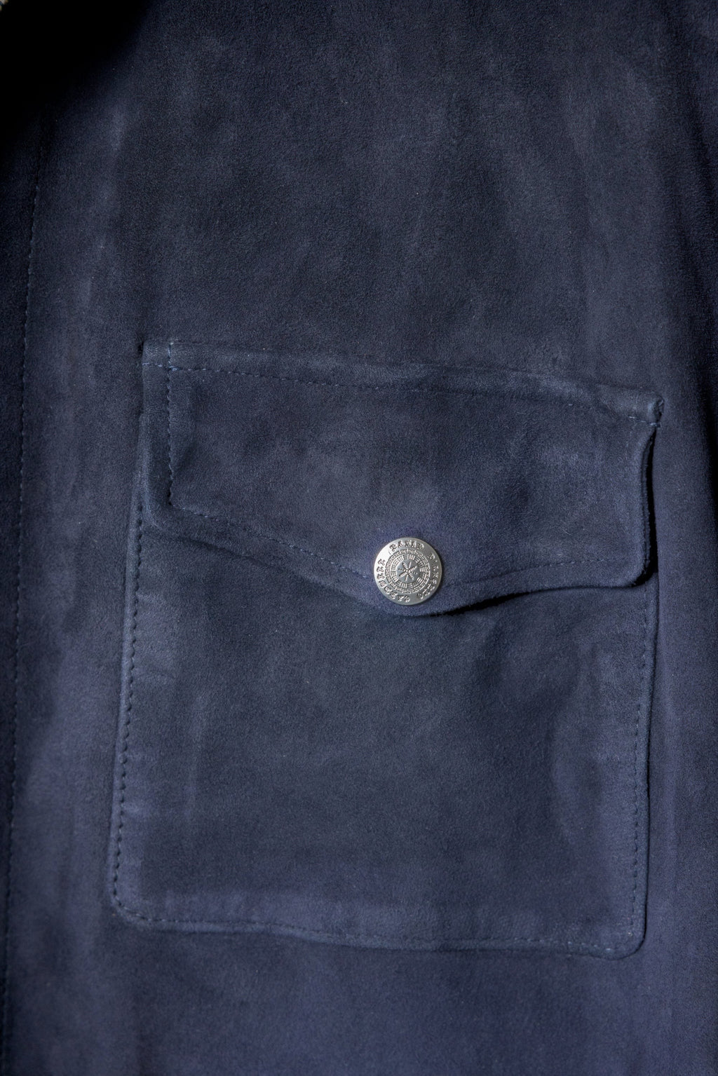 David Dangelo Caldwell navy blue suede artisan work shirt with a breast pocket and silver snap closure.