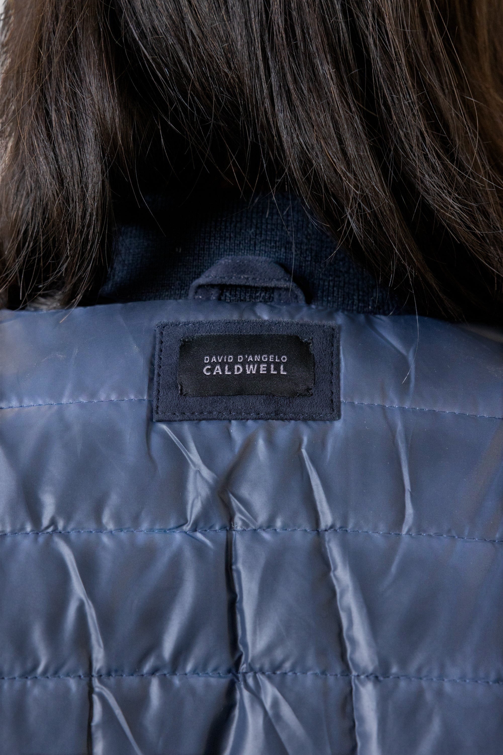 David Dangelo Caldwell navy blue reversible bomber jacket with puffer lining and suede exterior.