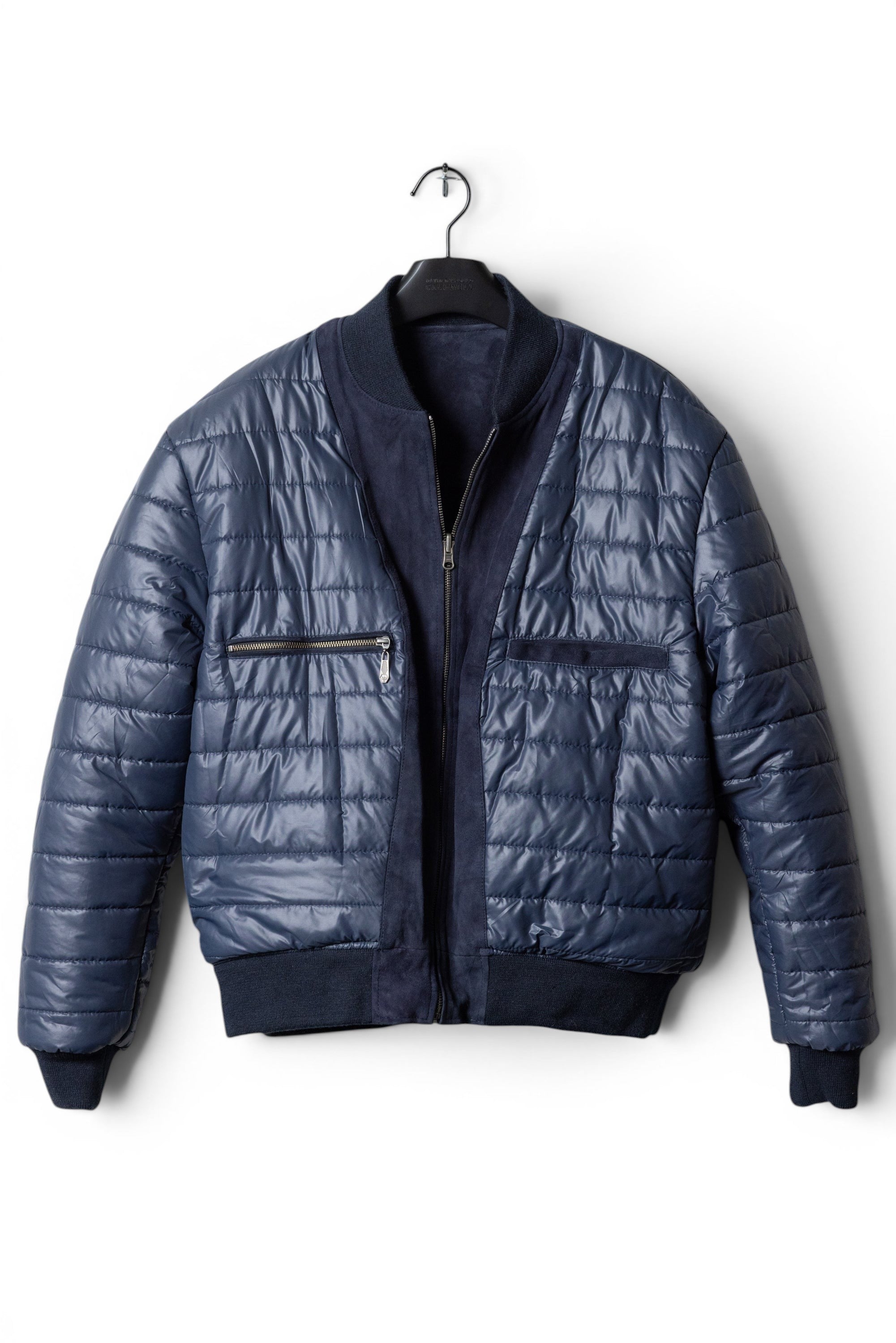 David Dangelo Caldwell navy blue reversible bomber jacket with suede accents and quilted puffer exterior.