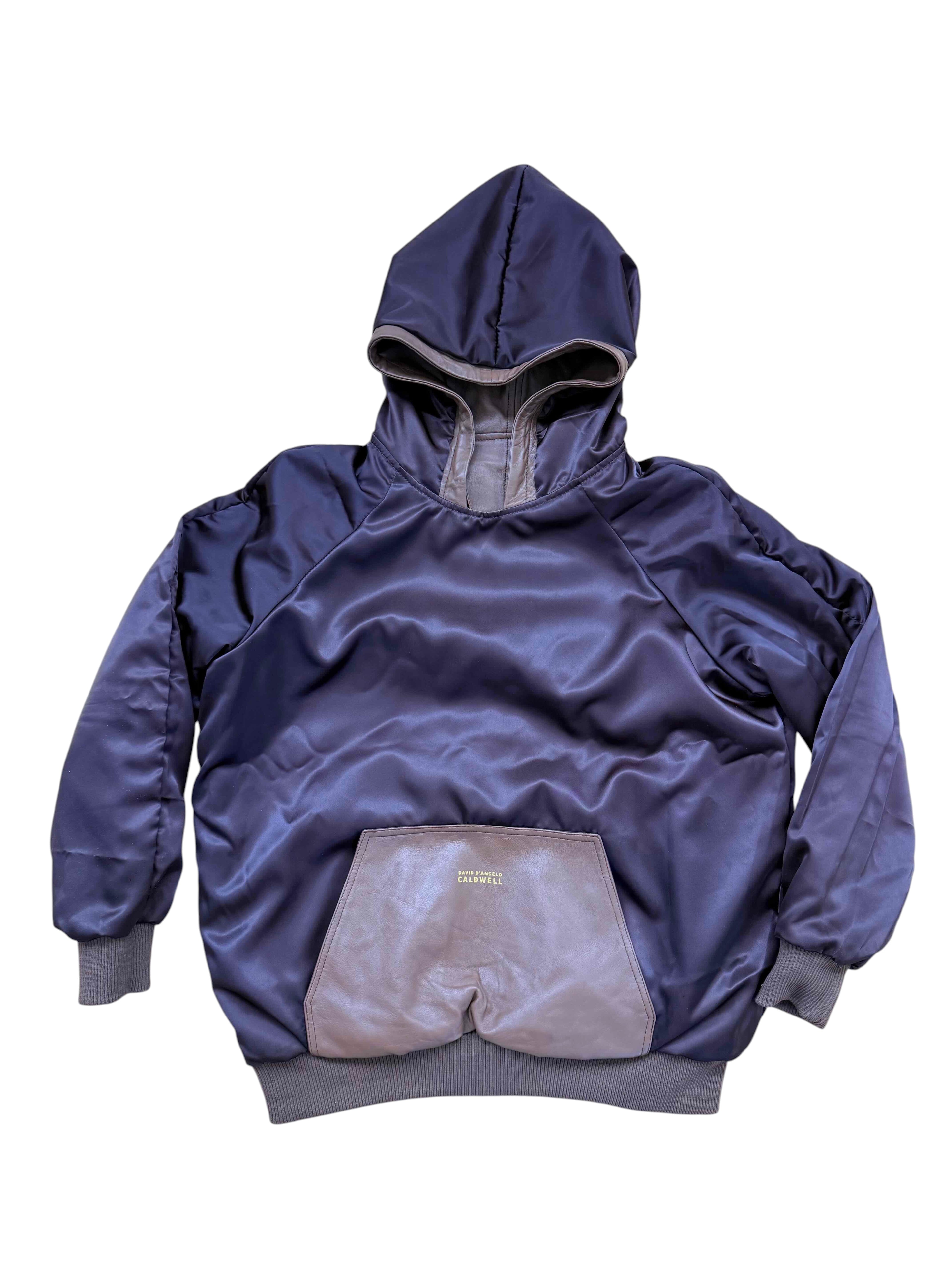 David Dangelo Caldwell reversible hoodie in brown satin with leather pocket detail and oversized hood. Features ribbed cuffs and hem.