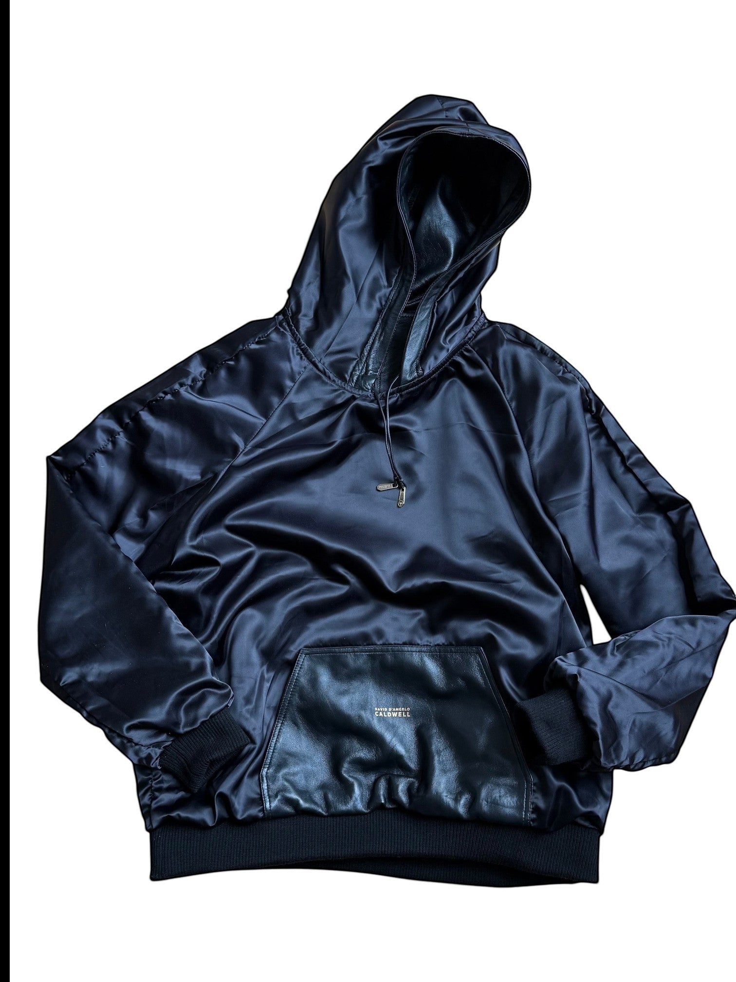David Dangelo Caldwell black satin reversible hoodie with leather accents and oversized hood.