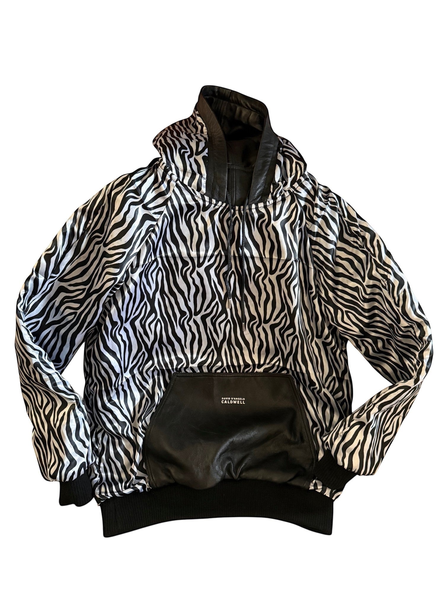 David Dangelo Caldwell reversible hoodie with zebra print satin and black leather accents. Features oversized hood and pockets.