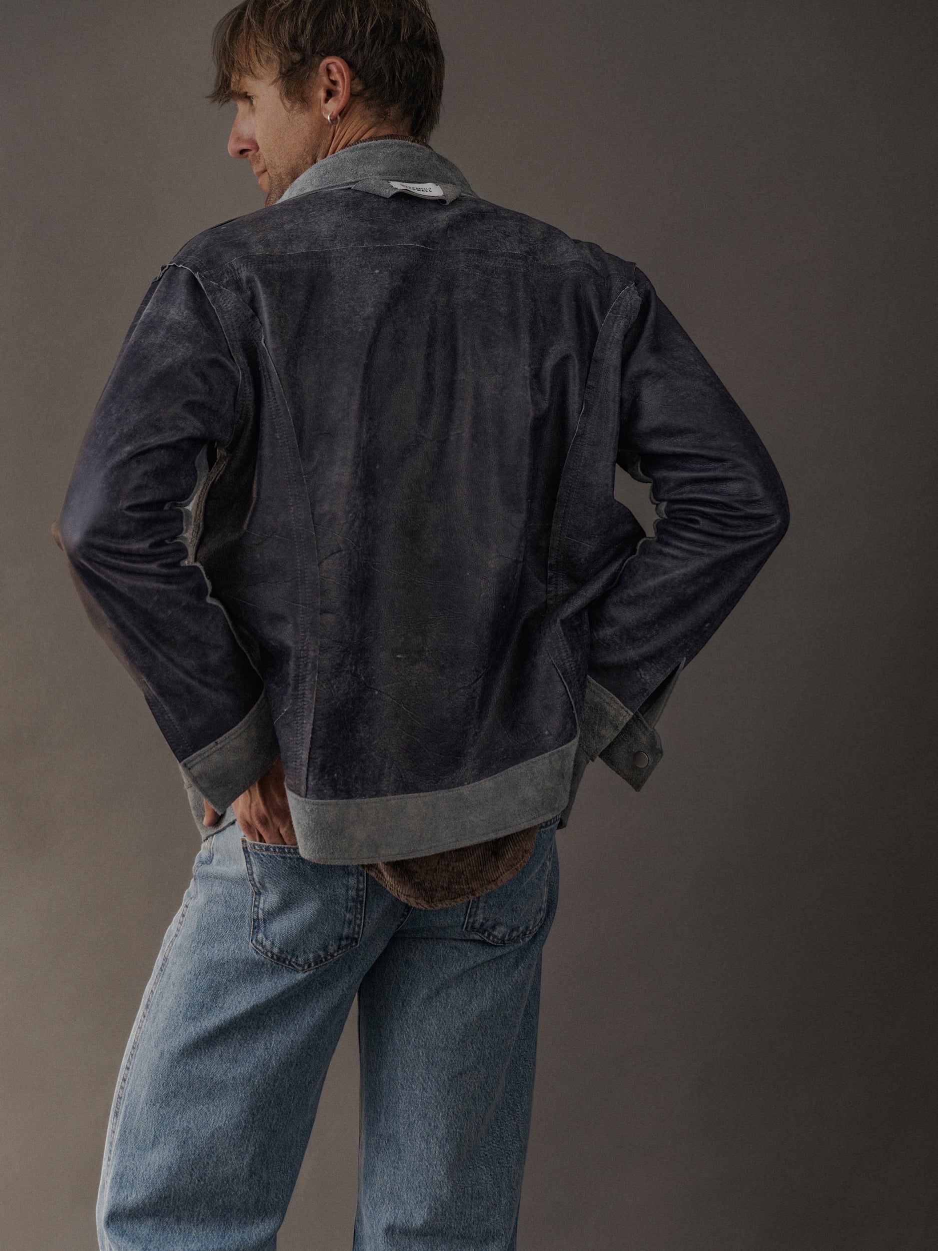 David Dangelo Caldwell dark blue distressed suede trucker jacket with grey accents, reversible design.