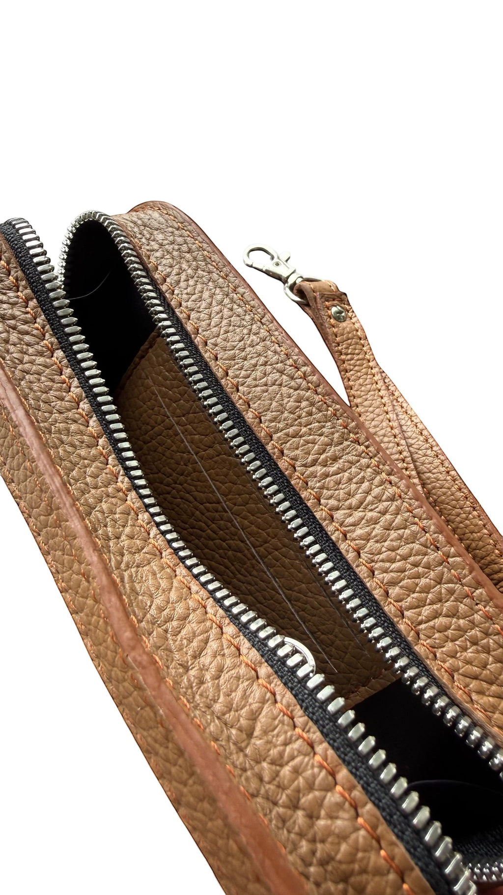 David Dangelo Caldwell tan leather wristlet clutch with zipper closure and detachable wrist strap.