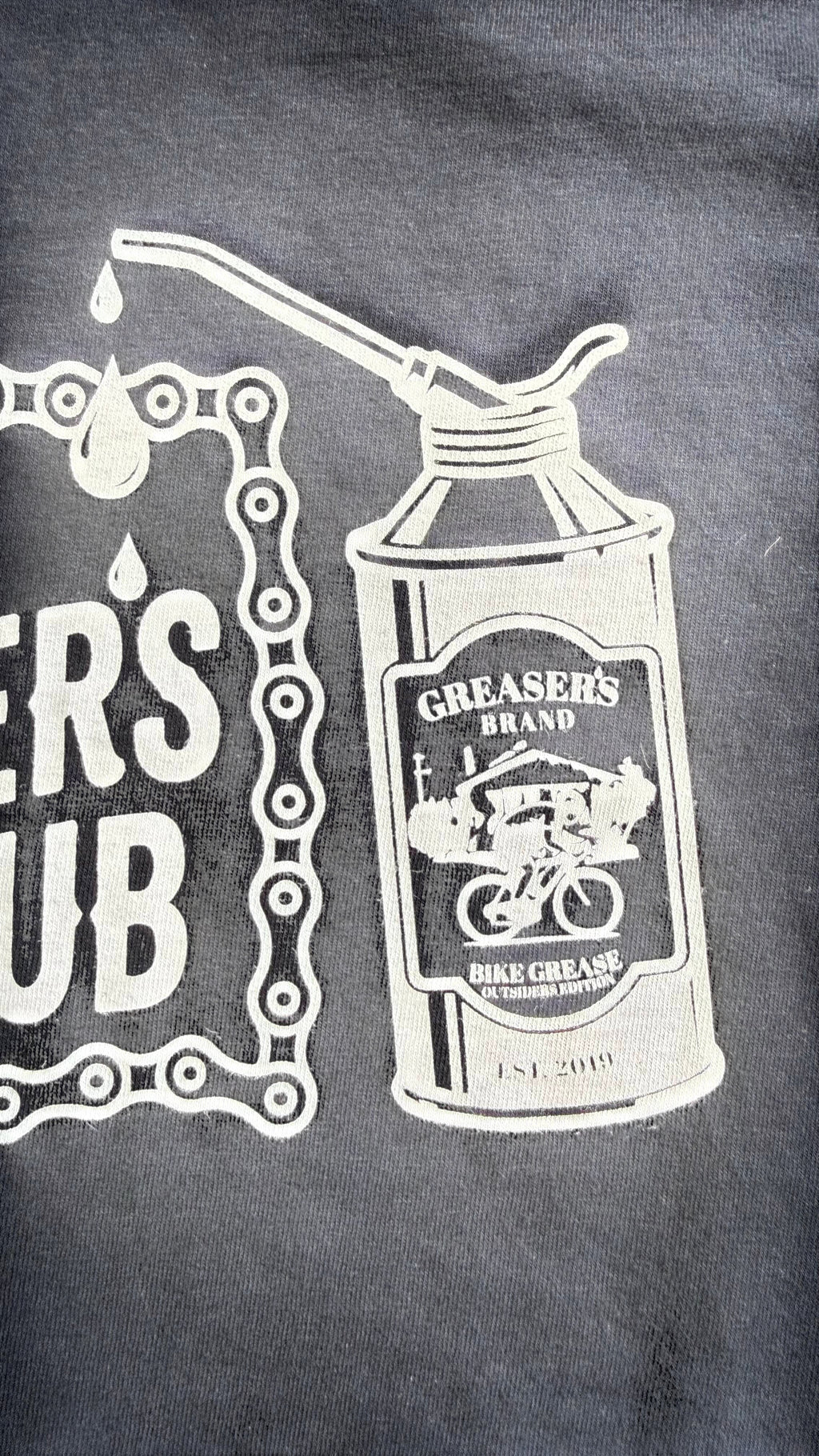 David Dangelo Caldwell Tulsa Greaser's Club 100% cotton t-shirt with bike grease graphic and chain detail.